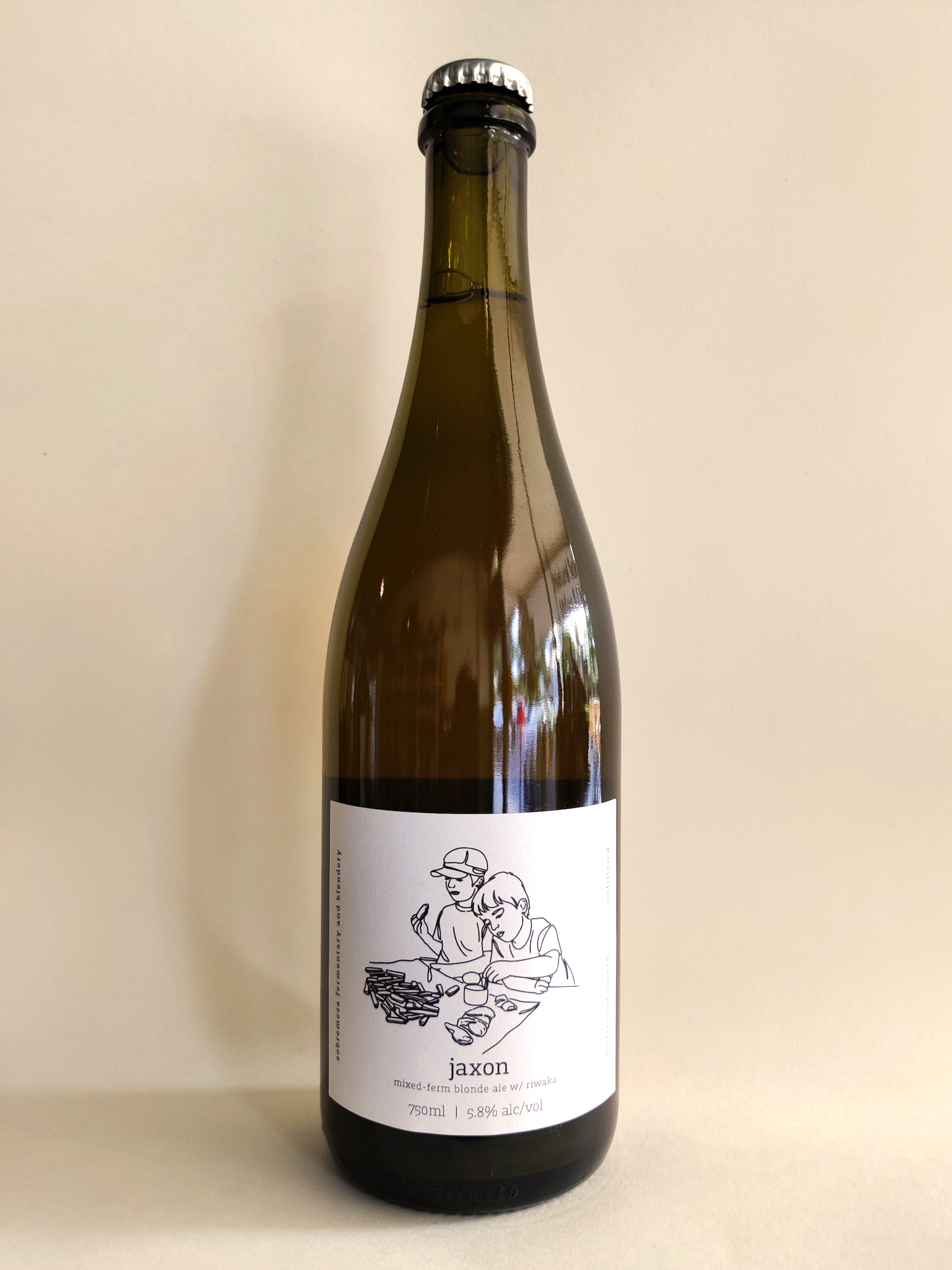 A 750ml bottle of Sobremesa "Jaxon" Wild Blonde Ale.